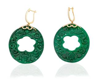 1126 A Pair of 18K Gold and Jade Earrings Of a carved oval design featuring a flower motif center 2 pieces  Measures: 2 1/2 x 1 1/2 in. 16.6 grams gross Estimate: $700 - $900