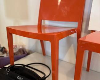 Kartell orange modern chairs