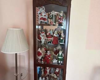 009 Santa Claus Figurine Collection in Display Cabinet
