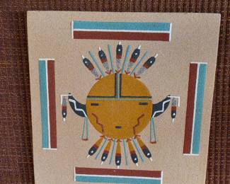 Golden sun-face sand painting