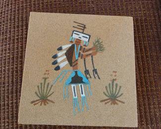 Turquoise figure sand painting