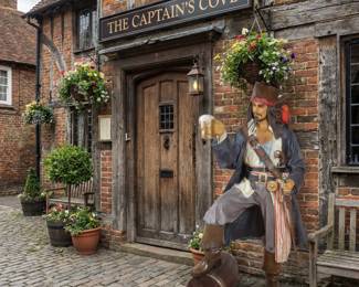 Standing pirate statue, nautical character sculpture and themed decor for a game room, restaurant or entertainment space.