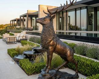 Large antlered stag statue, deer sculpture and statement wildlife decor for a garden, lodge or grand entrance.
