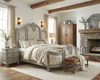 French country bedroom set with a carved upholstered bed, nightstand and wardrobe armoire in a soft neutral finish.