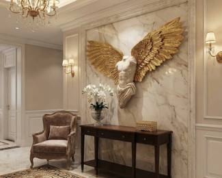 Gold-tone angel wing wall sculpture, dramatic wall art and decorative accents for a foyer or formal living room.