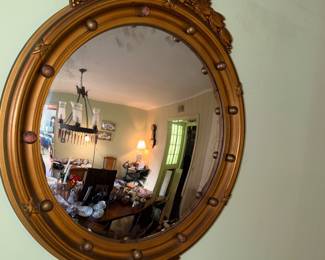 Federal-style gilt wood convex bullseye mirror with eagle on top