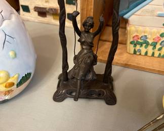 bronze girl on swing