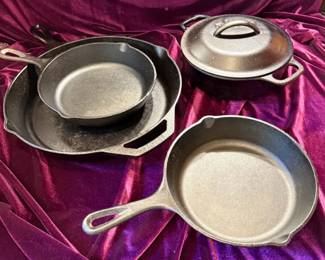 Three Cast Iron Pans and Small Dutch Oven Lodge and Cracker Barrel