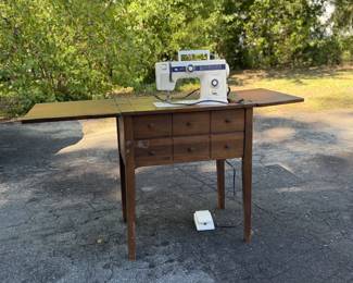 Sewing machine with cabinet