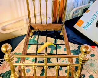 Victorian brass toy doll bed. Banana for scale!
