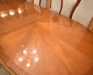 Romweber Dining Table-seats up to 12. Has 2 additional leaves and padded table covers. Comes with 6 chairs.