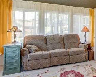 Tan sofa with 2 recliners, antique end table, stained glass lamp, modern lamp
