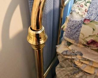 Two brass twin bed headboards