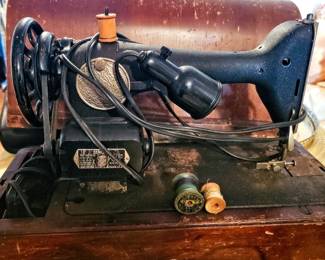 Very old Singer sewing machine and case