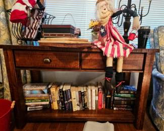 Wooden table, books, various bric-a-brac
