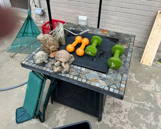 Fire pit table, and some of the concrete, gardening bench