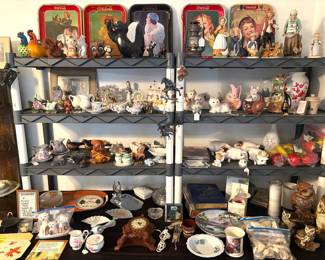 Huge vintage collectibles lot including Coca-Cola advertising trays, ceramic animal figurines, floral china teapots and cups, a mantel clock, a vintage oil lantern and cookbook, plus artificial fruit and a seashell collection.