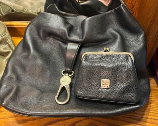 Dooney & Bourke Black Leather Hobo Bag with Coin Purse [IMG_2462] A black pebbled leather hobo-style shoulder bag with a key fob clip and a matching kiss-lock coin purse with a Dooney & Bourke plaque. A classic designer leather handbag for everyday use. The leather looks soft with light wear.
