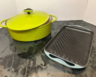 Rachael Ray Oval Casserole and Le Creuset Grill Pan A chartreuse enameled oval casserole with a lid, and a rectangular ridged grill pan with a light blue enameled exterior. Useful enameled cookware for braising, baking and stovetop grilling. No maker's mark is visible in the photo.