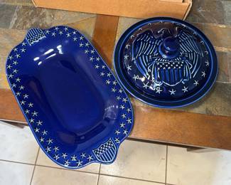 Cobalt Blue Eagle Covered Dish and Star Border Serving Tray A cobalt blue glazed covered dish with an embossed eagle and shield lid, plus an oval serving tray with a star border and flag shield handles. A patriotic serving set for the Fourth of July or Americana decor.