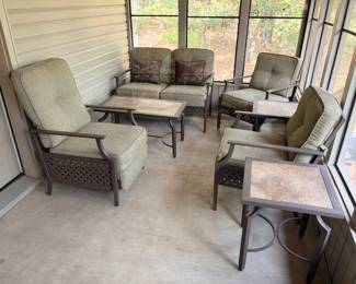 La-Z-Boy Patio Conversation Set – Loveseat, Three Chairs and Tile Top Tables A La-Z-Boy outdoor patio conversation set with metal frames and sage green cushions, including a loveseat with accent pillows, three cushioned chairs, a tile-top coffee table and two tile-top side tables. Comfortable La-Z-Boy outdoor furniture for a screened porch or patio. The cushions look clean in the photo.