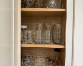 Kitchen Glassware Lot – Tumblers, Dessert Cups and Martini Glasses A cabinet of everyday glassware, including square-pattern tumblers, highball glasses, footed dessert cups, martini glasses, cut-pattern rocks glasses and more. A practical drinking glass lot for a kitchen, bar or second home.