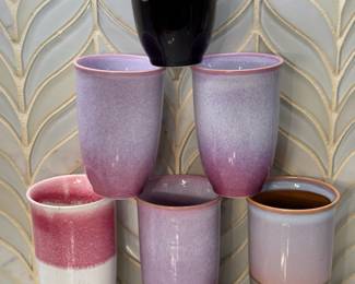 Set of Six Reactive Glaze Ceramic Tumblers Six tall ceramic tumblers in reactive drip glazes in purple, pink, blue and speckled cream tones. These handmade-look cups work for water, iced coffee or as small vases. The glaze colors vary piece to piece.