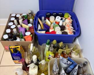 Bath and Body Lotion, Soap and Shower Gel Lot A large lot of personal care products, including hand soaps, body lotions, shower gels, bath products and toiletries in bins and boxes. A practical lot for stocking household or guest baths.