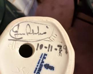 Lladró Porcelain Backstamp with Artist Signature A close-up of a figurine base showing the blue Lladró "Hand Made in Spain" backstamp, an artist signature in marker and a handwritten date. A useful hallmark photo for collectors checking a Lladró piece.