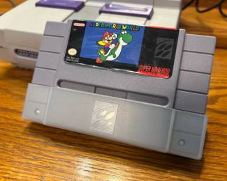 Super Mario World Super Nintendo Game Cartridge A Super Mario World game cartridge for the Super Nintendo Entertainment System, with the label intact. A classic SNES game for retro gaming collectors and players. Working condition not confirmed — sold as found.