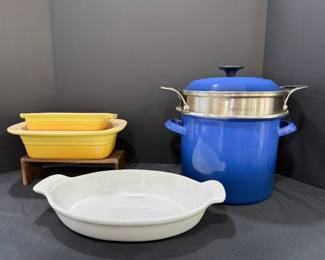 Blue Enameled Stockpot with Le Creuset Steamer Insert and Bakers A blue enameled stockpot with a lid and a stainless steamer insert marked Le Creuset, plus two yellow rectangular bakers and a white oval baking dish. A useful kitchen lot for soups, pasta and casseroles.