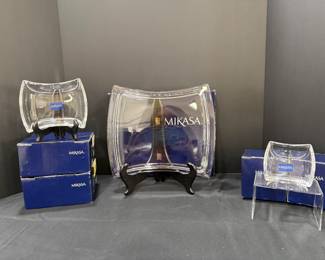 Mikasa Curved Serving Trays with Boxes Three Mikasa clear serving trays with a curved, pillow-like shape in small, medium and large sizes, shown with their blue Mikasa boxes. Modern platters for appetizers, desserts or decorative display. A gift-ready lot.
