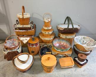 Longaberger Basket Collection with Floral Liners and Wood Lids A large lot of Longaberger baskets with floral fabric liners, wooden lids, a stacked set of graduated lidded baskets, a multicolor woven bowl, casserole baskets with white inserts and other accent baskets. A strong Longaberger collection for serving, storage and decor.