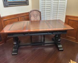 Writing desk, tabletop features and in line 3 panel leather surface ordered by rich cherry or warm, walnut wood trim.
