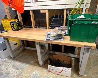 Adjustable work bench. Solid maple top.