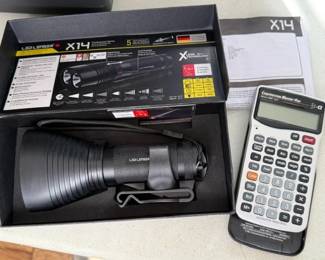 Tactical flashlight. Contractor calculator. 