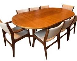 Mid-Century ABJ of Denmark Table with 8 Chairs. Chairs: 8 coordinating chairs, including armchairs and side chairs Construction: Sculpted wood frames with upholstered seats and backs Condition: Light vintage wear Dimensions: 86" W x 47" D x 27" H