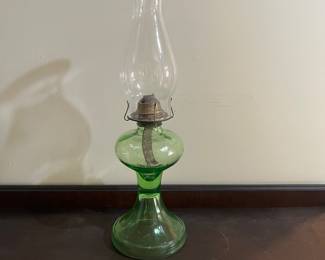 H45 - $125. Vintage uranium glass oil lamp. Glows with black light!Measures 18" tall.