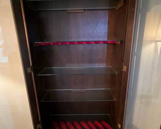 H41 - $100. Glass front gun cabinet with glass shelves added for display cabinet. Measures 31.5" x 12" x 70.5"T. No key.