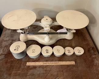 H51 - $110. Vintage Detecto No. 1 cast iron balance scale with weights.