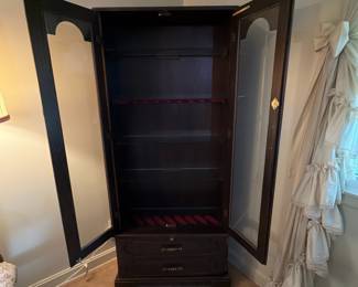 H41 - $100. Glass front gun cabinet with glass shelves added for display cabinet. Measures 31.5" x 12" x 70.5"T. No key.
