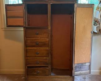 H19 - $50. Wardrobe with cabinet, 5 drawers, and clothes bar. Measures 37.25" x 16.5" x 66"T. Some surface wear and a sticker on the mirror, but overall good condition.