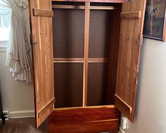 H65 - $95. Cedar Armoire/Wardrobe with Hanging Bar. Measures 36" x 22" x 70.25"T. Very good condition.