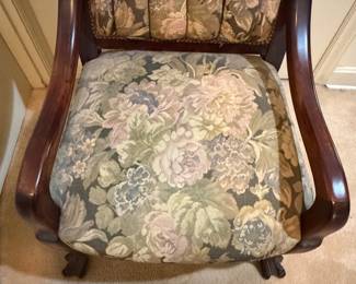 H30 - $50. Wood carved chair with floral upholstery. Measures 21.5" x 22" x 38.75"T, floor to seat 17"T.