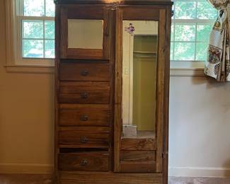 H19 - $50. Wardrobe with cabinet, 5 drawers, and clothes bar. Measures 37.25" x 16.5" x 66"T. Some surface wear and a sticker on the mirror, but overall good condition.