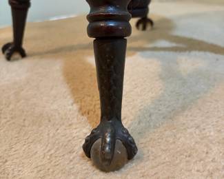 H31 - $75. Adjustable height carved piano stool. Measures 14.5" x 19"T.