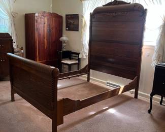 H9 - $150. Antique High Back Tiger Oak Double Bed. Measures 57.5" x 81" x 78"T, footboard 35.75"T. Very good condition - foot board has a weak spot on the top that should be an easy repair.