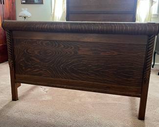 H9 - $150. Antique High Back Tiger Oak Double Bed. Measures 57.5" x 81" x 78"T, footboard 35.75"T. Very good condition - foot board has a weak spot on the top that should be an easy repair.
