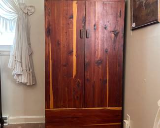 H65 - $95. Cedar Armoire/Wardrobe with Hanging Bar. Measures 36" x 22" x 70.25"T. Very good condition.