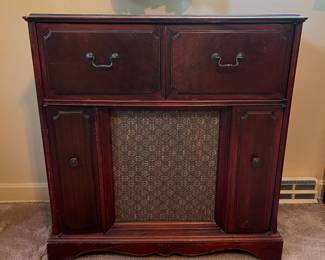H1- $100. Emerson radio and stereo cabinet. Model 586. Measures 33.25" x 16" x 34.5"T. Surface wear. Not in working condition.